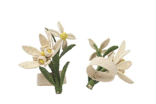 Two floral hair clips with green leaves on a white background